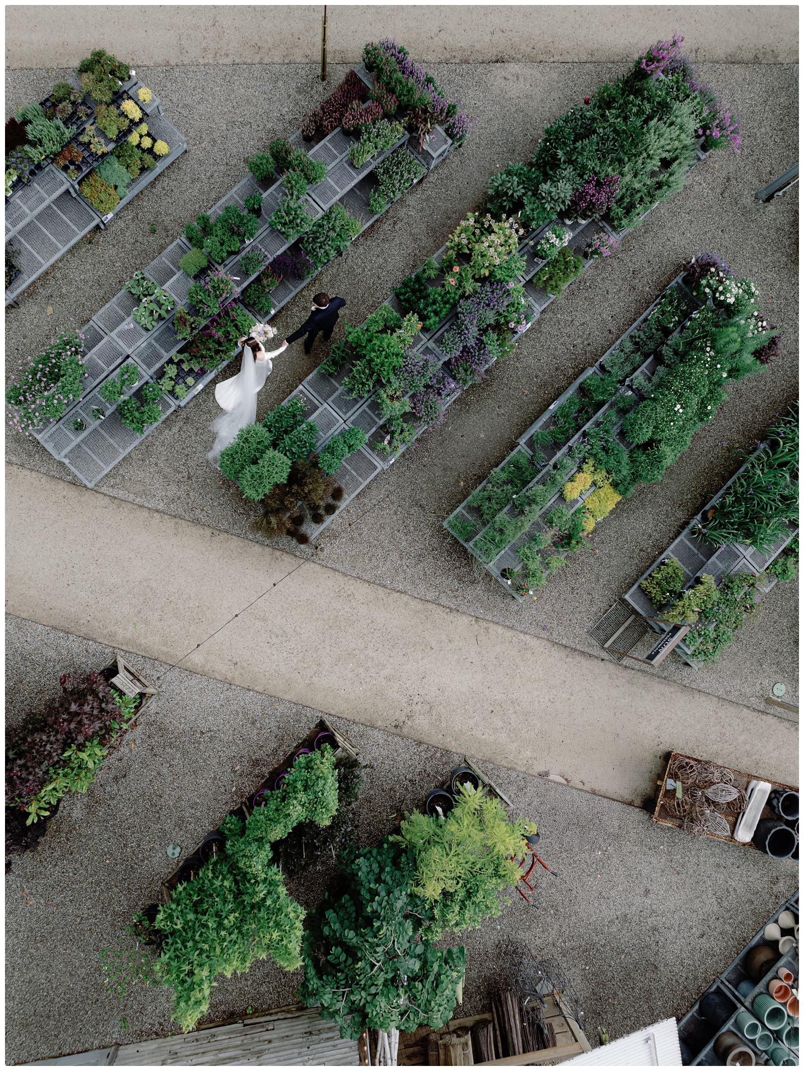 wedding drone photo of bride and groom walking